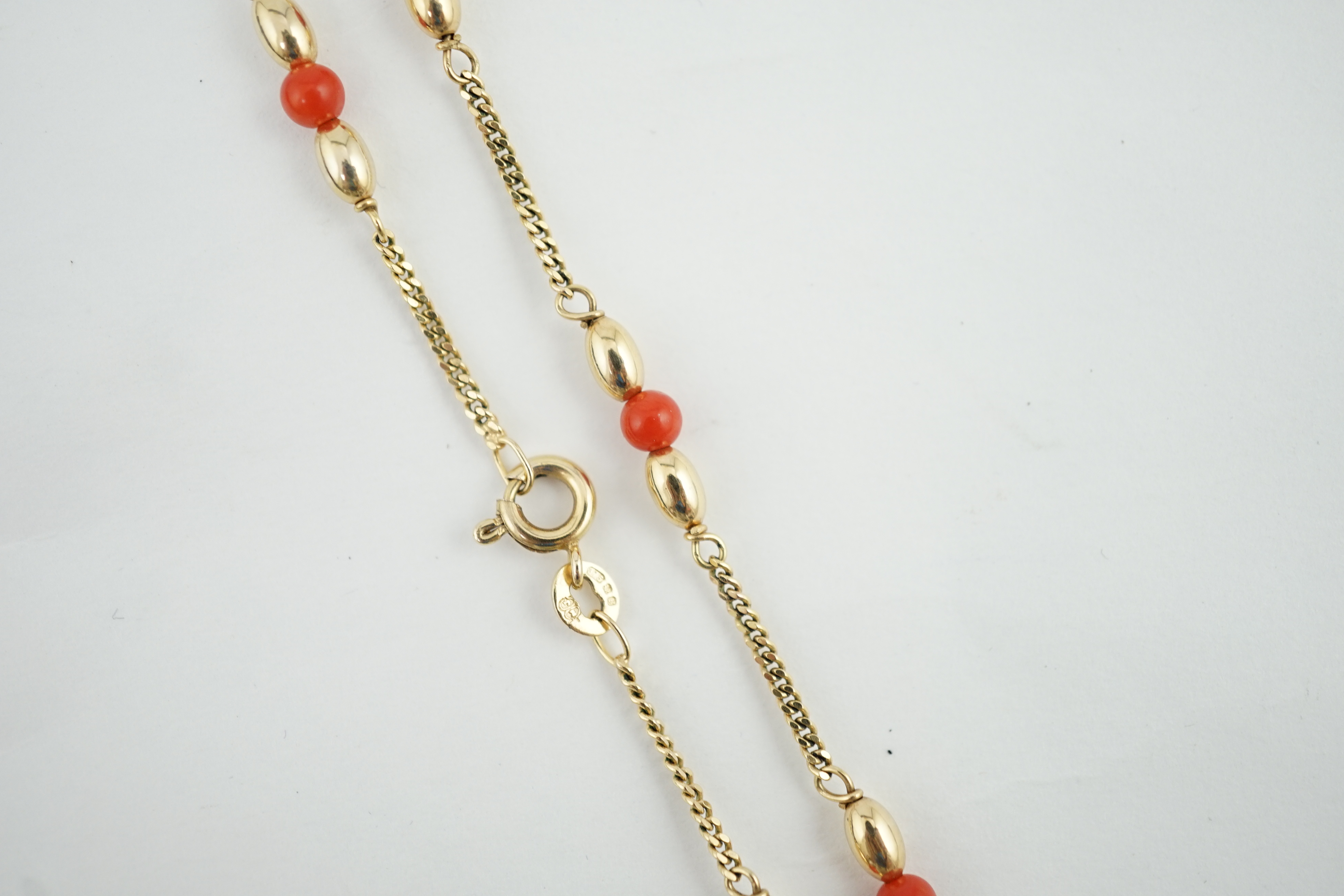 A modern 9ct gold and coral bead chain necklace